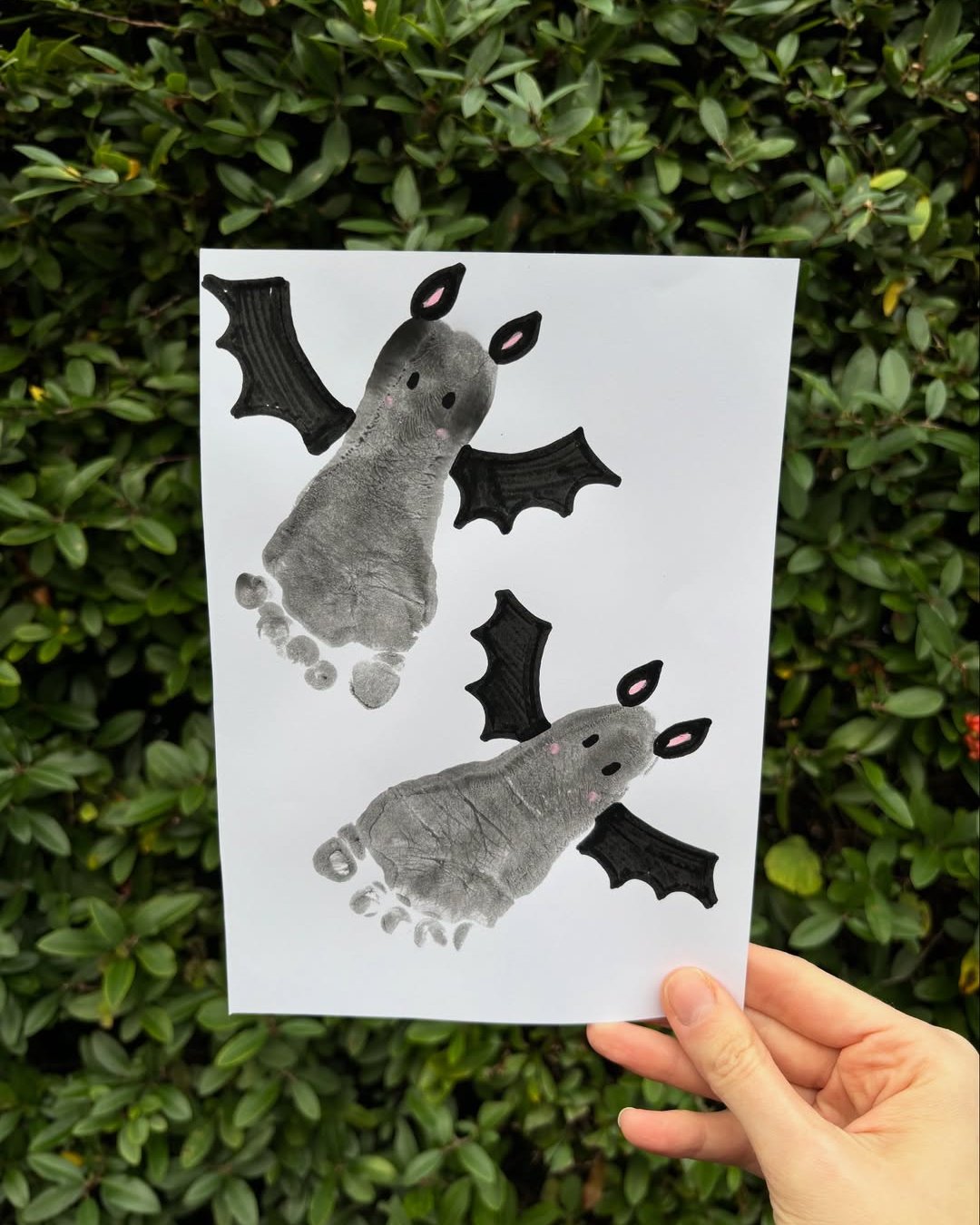 Halloween Crafts for Kids featuring adorable footprint bats on paper