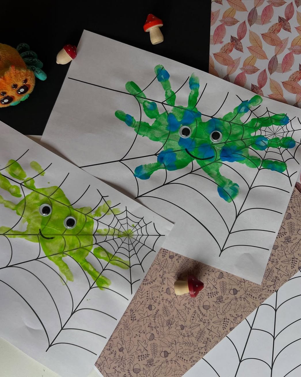Bright painted spider friends on webs for a playful seasonal art activity