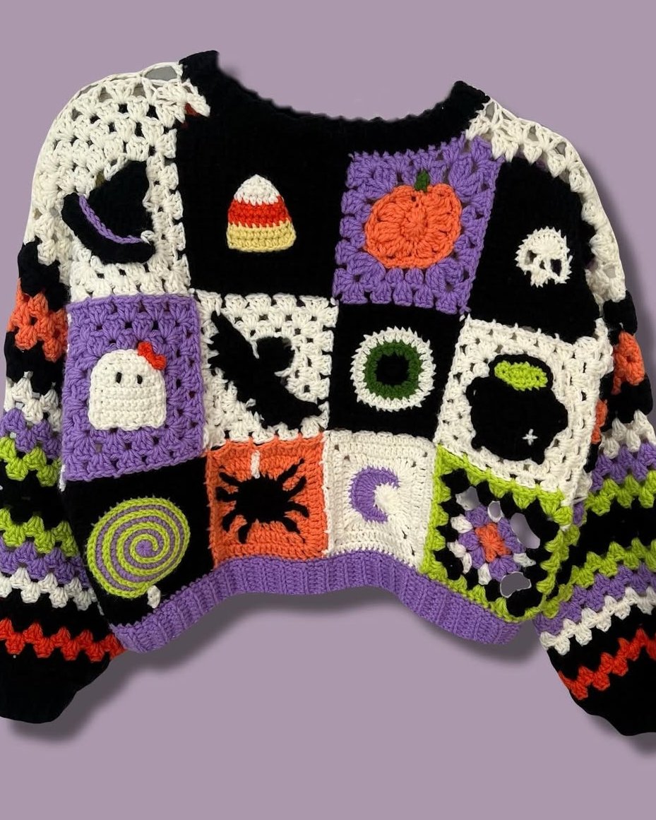 Patchwork Halloween crochet sweater with pumpkins, ghosts, bats, candy corn, and spooky granny squares