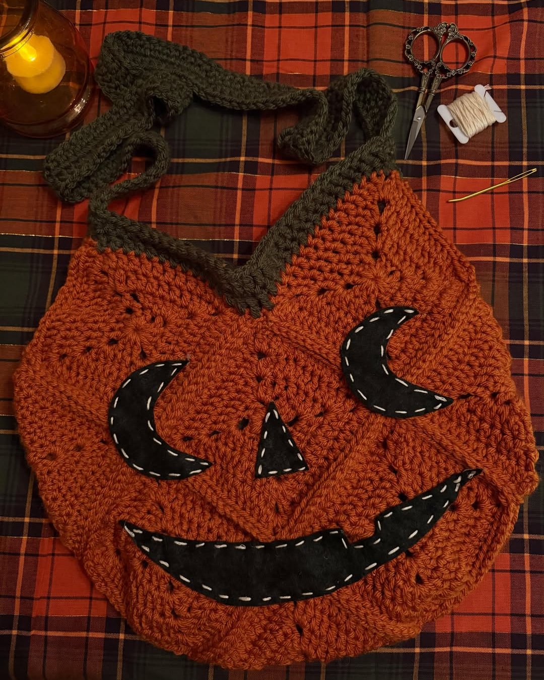 Halloween Crochet Ideas featuring a chunky orange pumpkin tote with crescent moon facial details