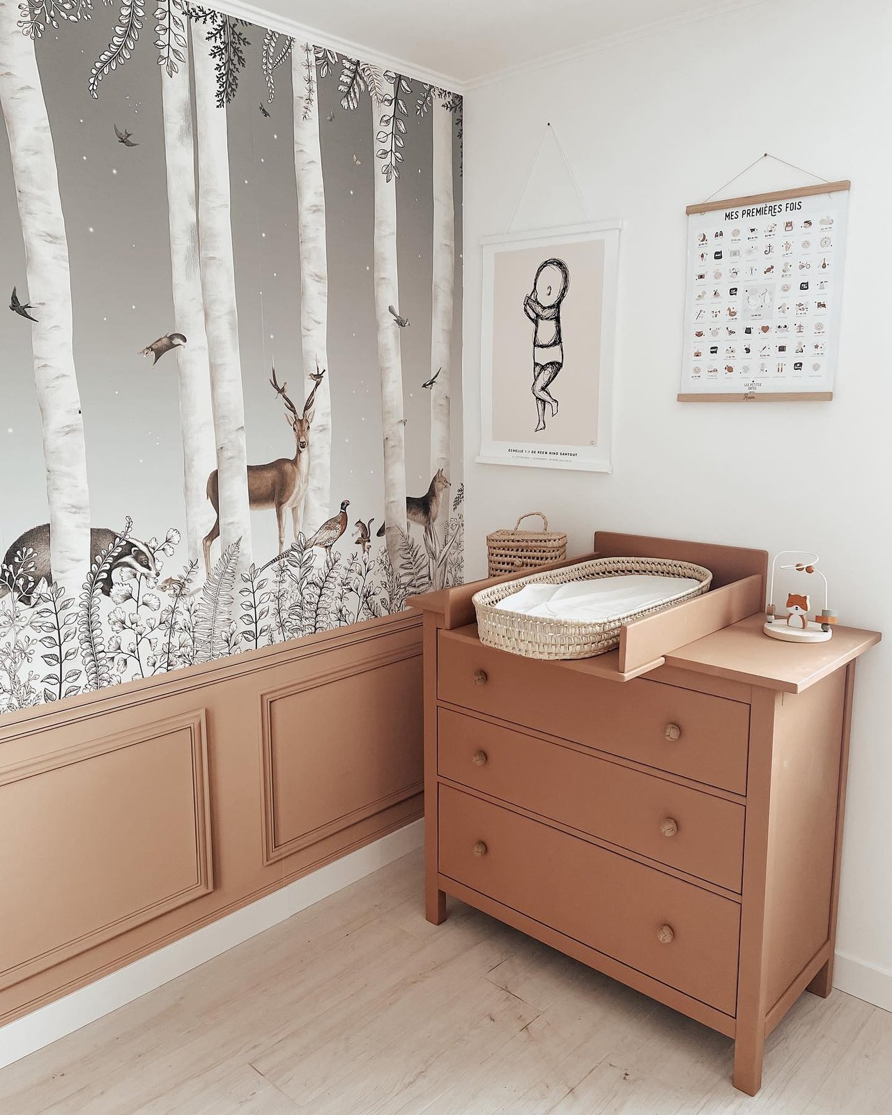 Blush Hemnes dresser converted into a woodland nursery changing station with woven basket