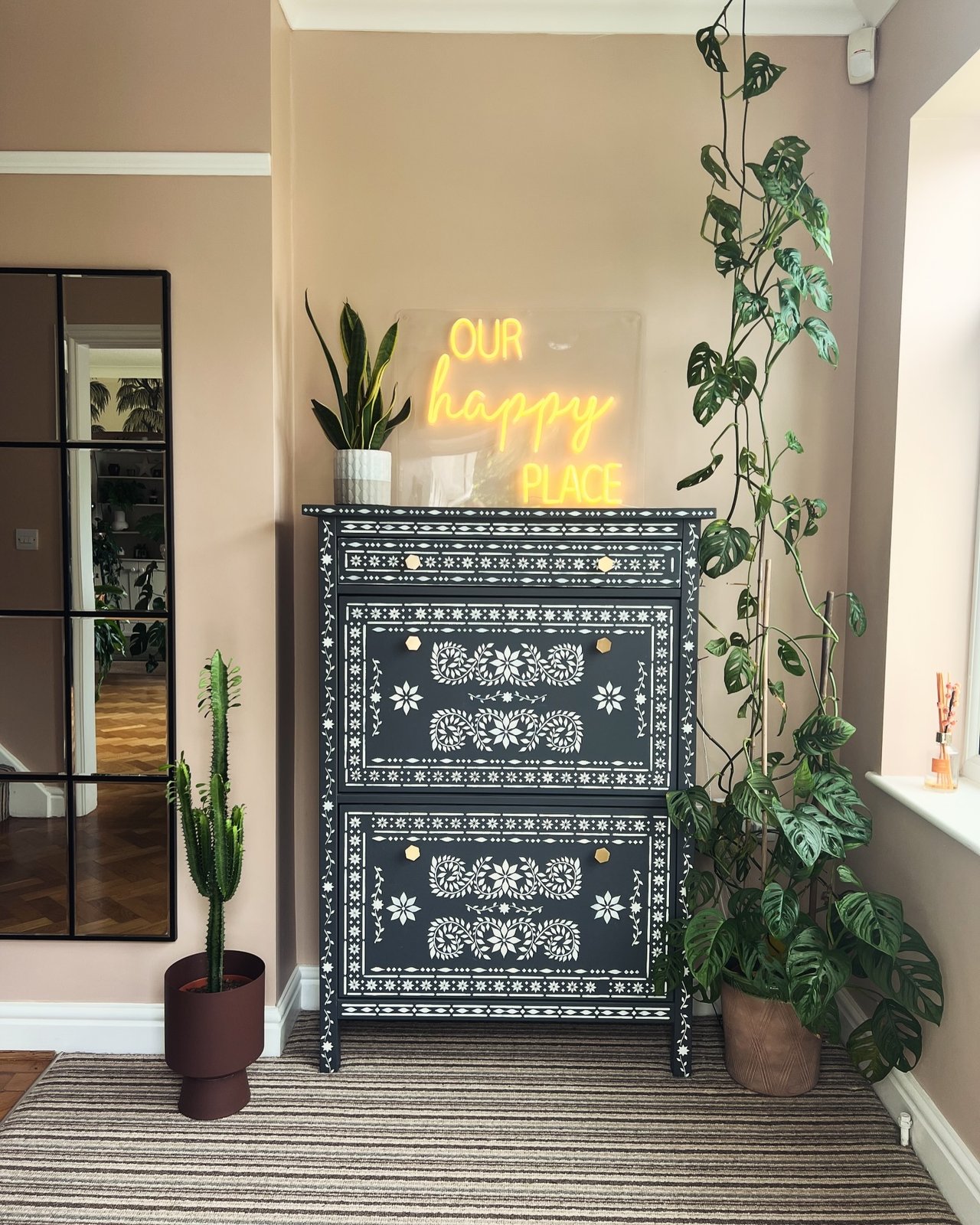 ikea hemnes hacks dresser with charcoal paint, white decorative stencils, and gold-toned knobs