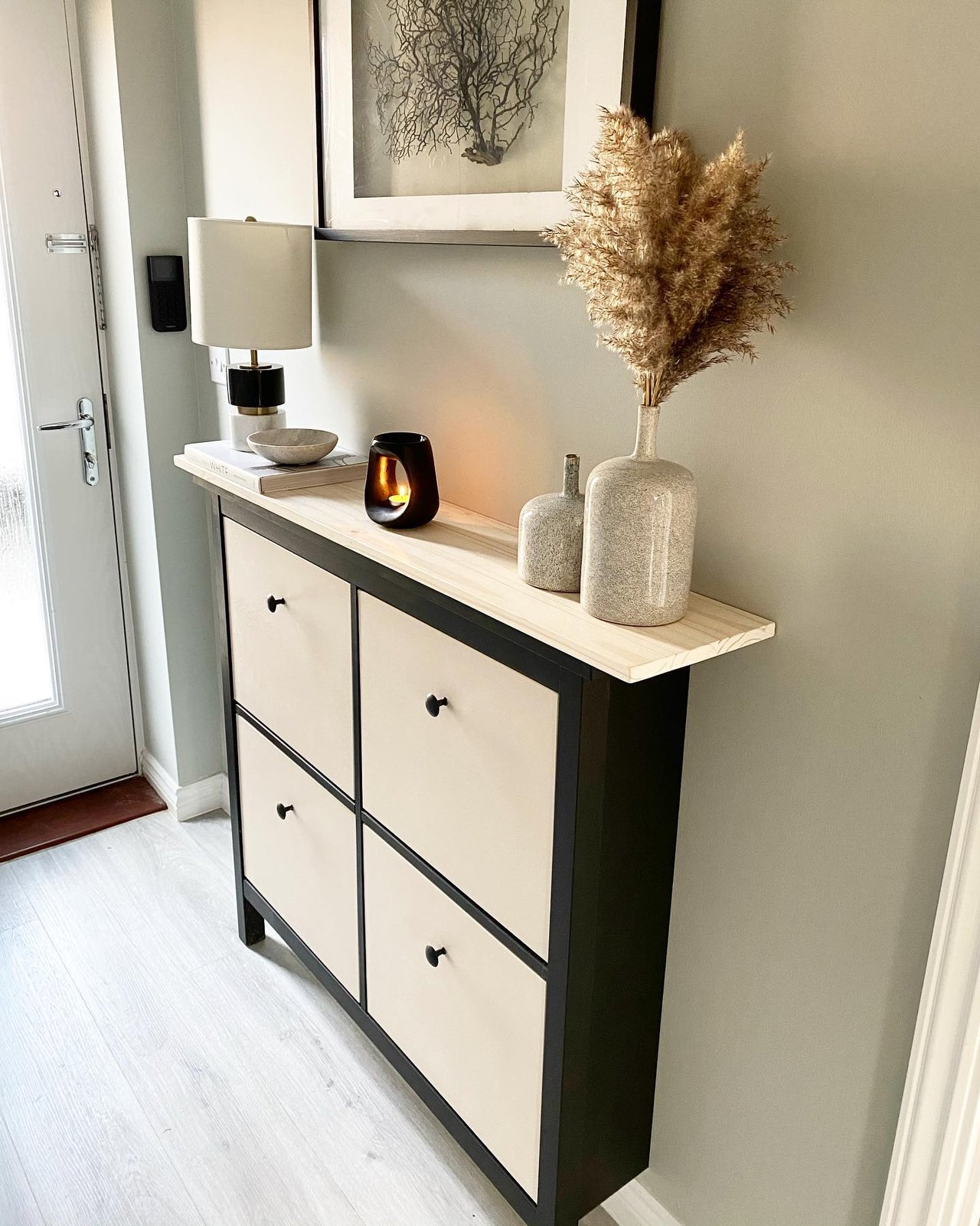 Black HEMNES shoe cabinet with light wood top in a stylish entryway makeover