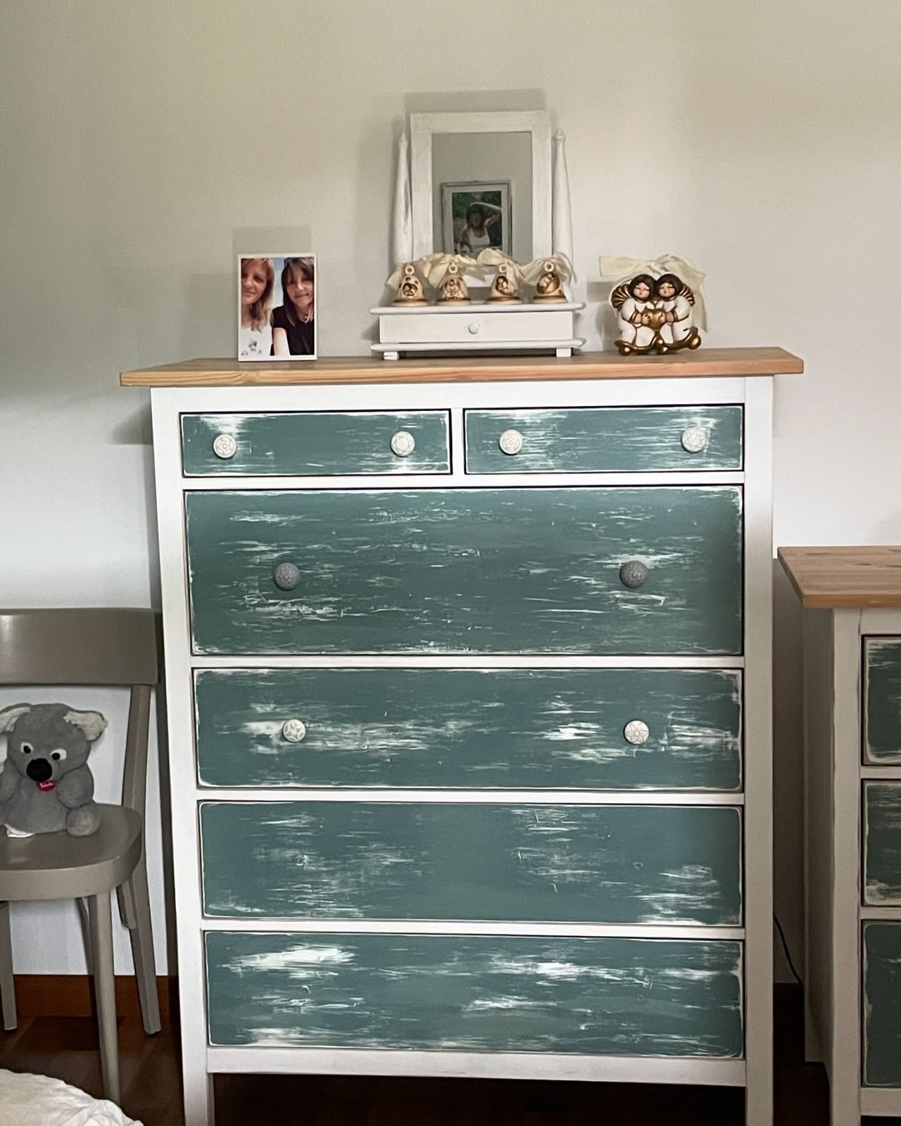 IKEA Hemnes hacks dresser with distressed teal drawers, white frame, wood top, and decorative knobs