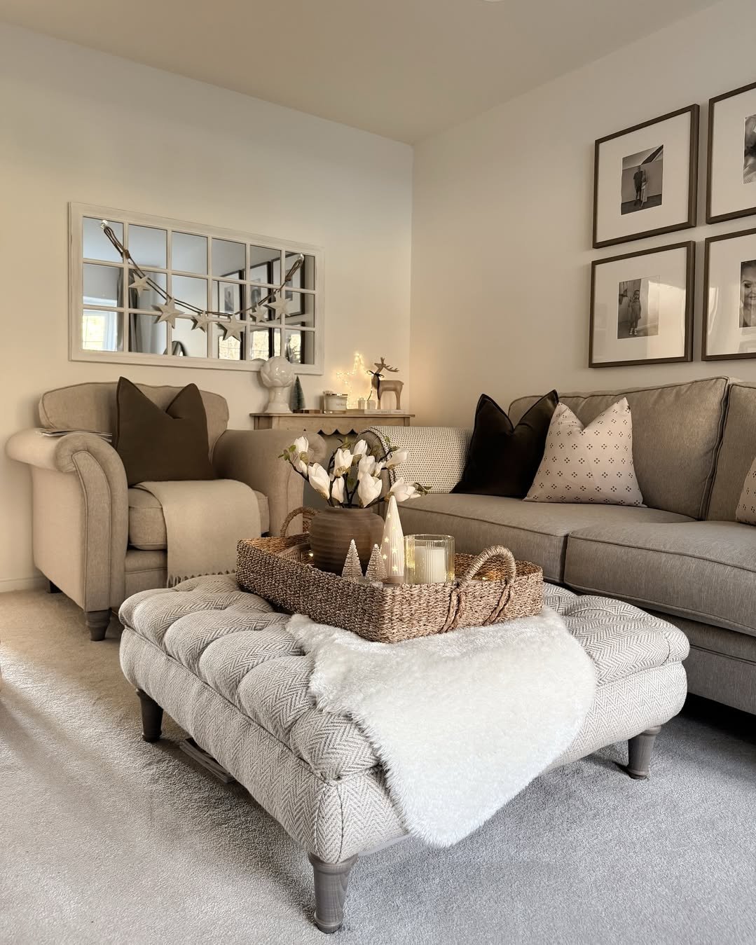 Soft neutral living room with faux-fur throw, woven tray, candles, and subtle winter accents